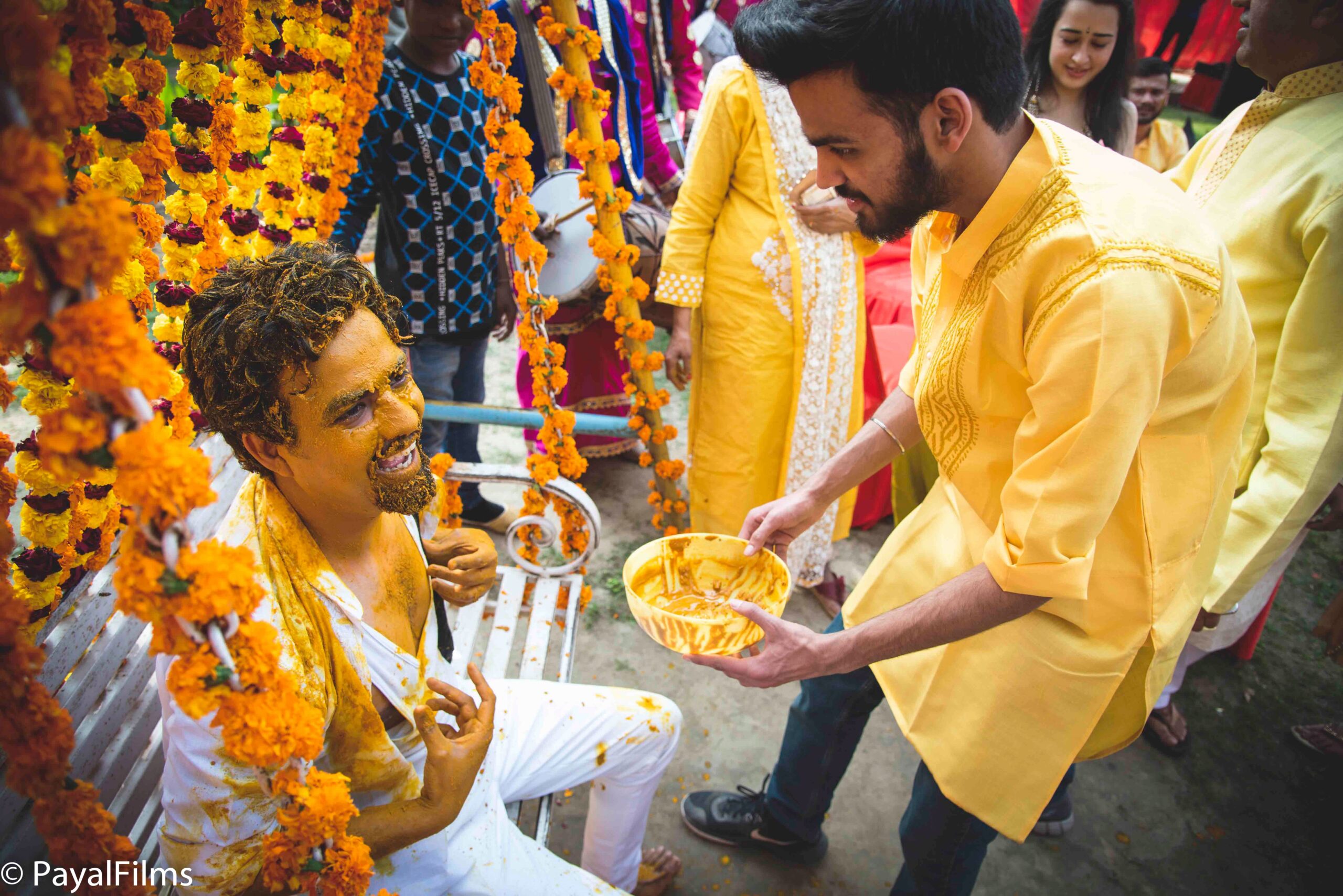 Payal Films haldi ceremony family members applying turmeric paste at Bihar wedding