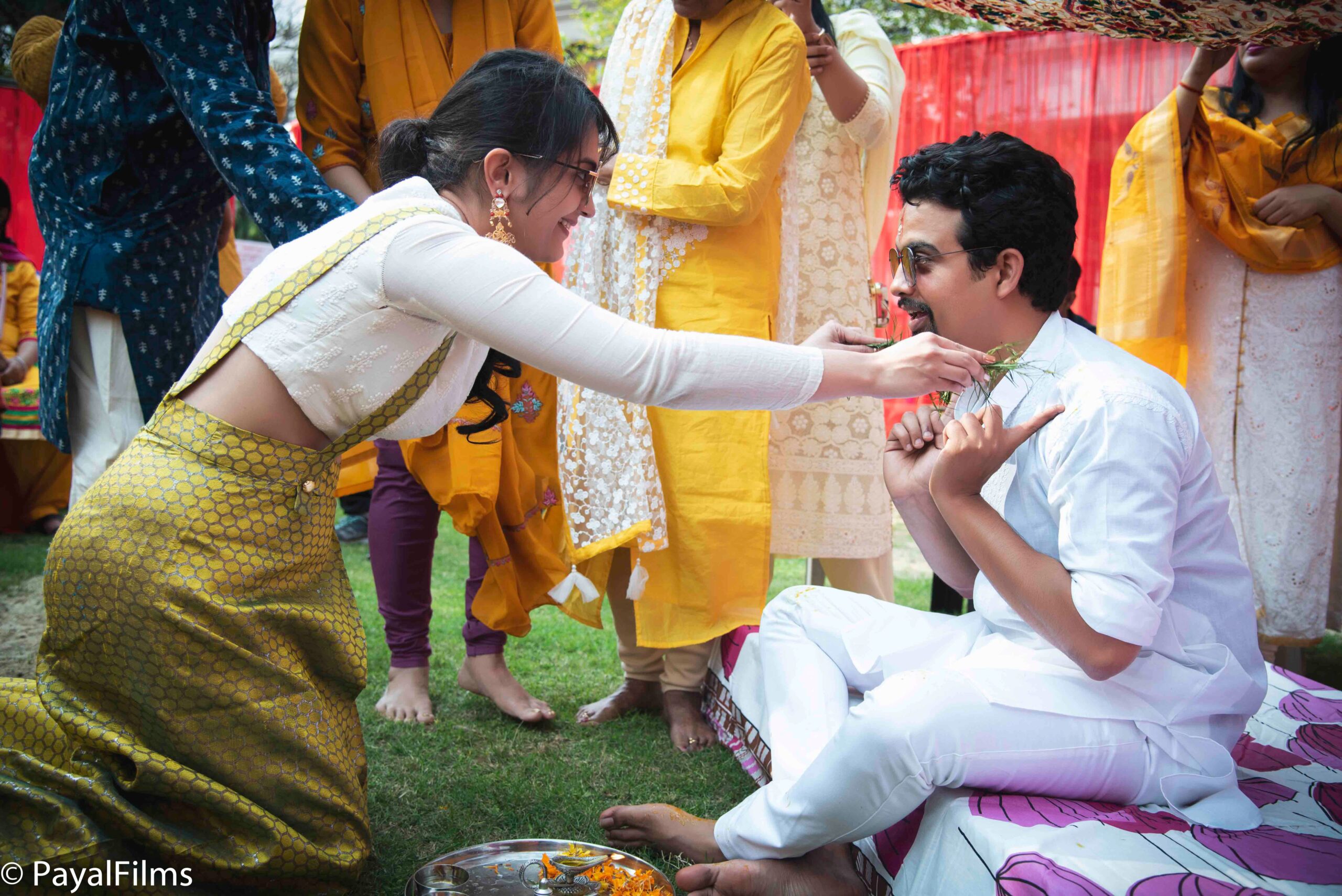 Payal Films candid haldi ceremony with family and friends performing traditional ritual in Bihar