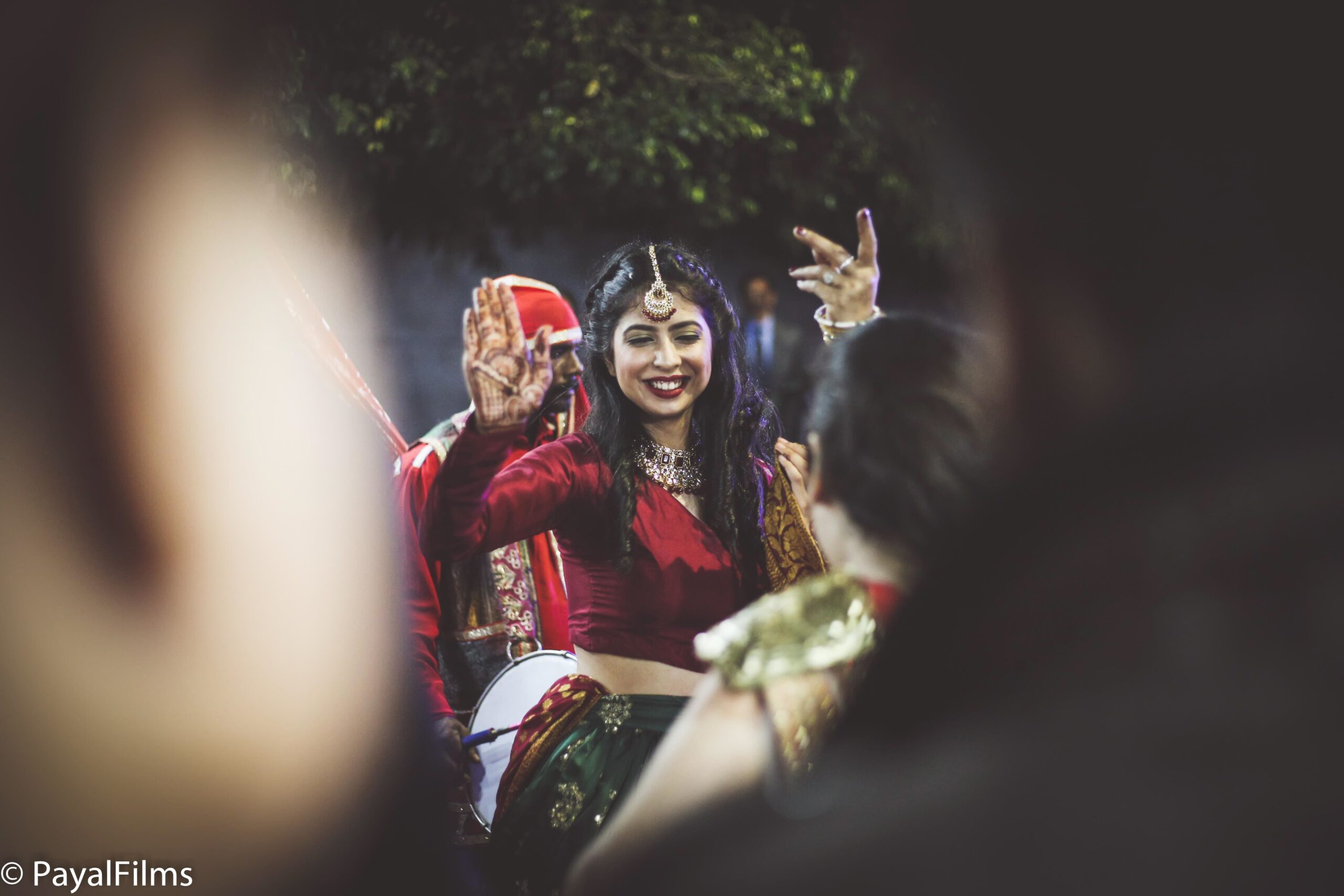 Payal Films candid wedding dance moment with bride in red attire, festive celebration in Bihar